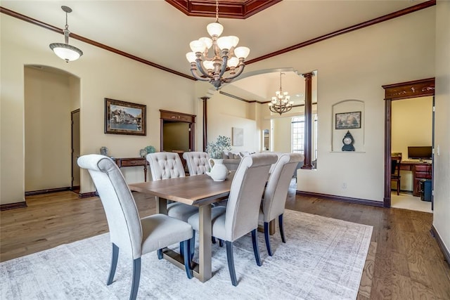 1704 NW 171st St, Edmond, OK 73012 - dining area featuring a chandelier, wood finished floors, crown molding, and a tray ceiling