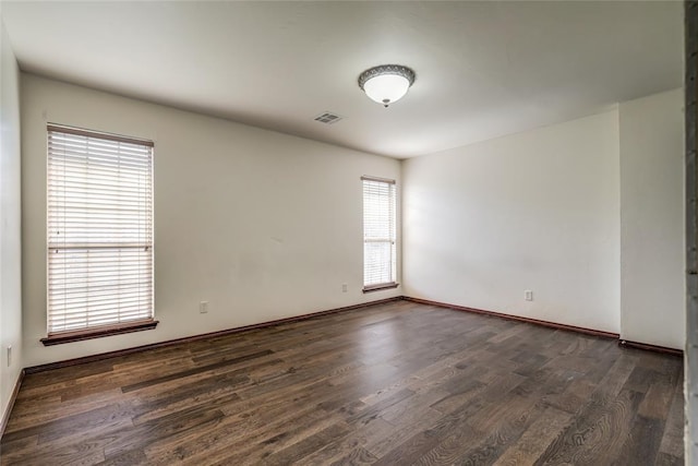 1704 NW 171st St, Edmond, OK 73012 - spare room with dark wood-style floors
