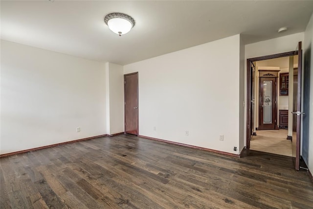 1704 NW 171st St, Edmond, OK 73012 - unfurnished room with dark wood-type flooring and a smoke detector
