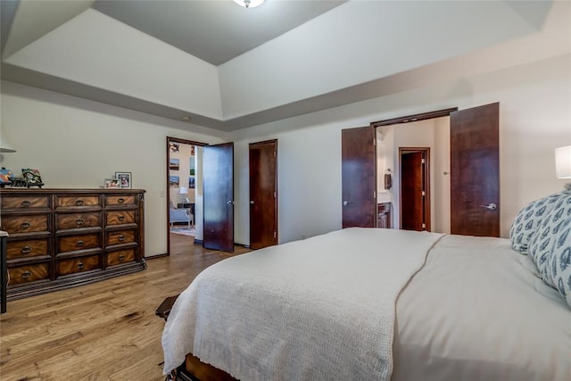 1704 NW 171st St, Edmond, OK 73012 - bedroom featuring wood finished floors and lofted ceiling