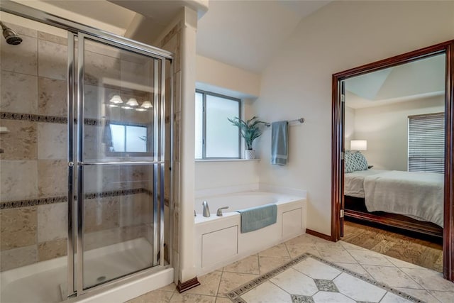 1704 NW 171st St, Edmond, OK 73012 - ensuite bathroom with a garden tub, a stall shower, lofted ceiling, and tile patterned flooring