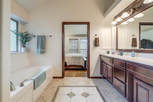 1704 NW 171st St, Edmond, OK 73012 - ensuite bathroom featuring double vanity, a bath, plenty of natural light, and tile patterned floors