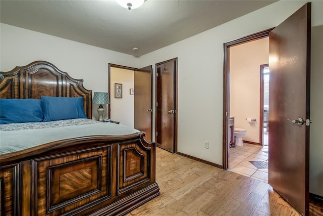 1704 NW 171st St, Edmond, OK 73012 - bedroom with light wood-type flooring and ensuite bath