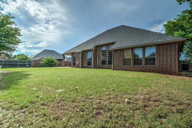 1704 NW 171st St, Edmond, OK 73012 - rear view of house featuring brick siding and a shingled roof