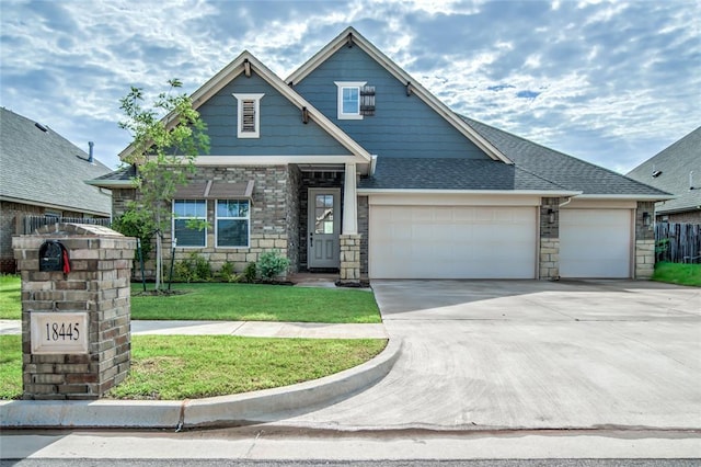 18445 Austin Pl, Edmond, OK 73012 - craftsman-style house featuring an attached garage, concrete driveway, a front lawn, and stone siding