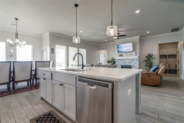 18445 Austin Pl, Edmond, OK 73012 - kitchen featuring dishwasher, a ceiling fan, open floor plan, recessed lighting, and a chandelier