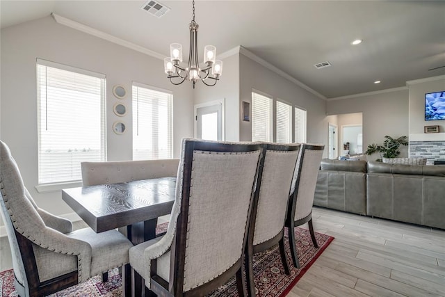 18445 Austin Pl, Edmond, OK 73012 - dining area with a chandelier, ornamental molding, light wood-type flooring, and recessed lighting