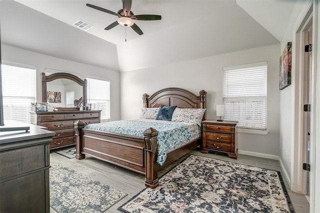 18445 Austin Pl, Edmond, OK 73012 - bedroom with vaulted ceiling, ceiling fan, and light wood finished floors