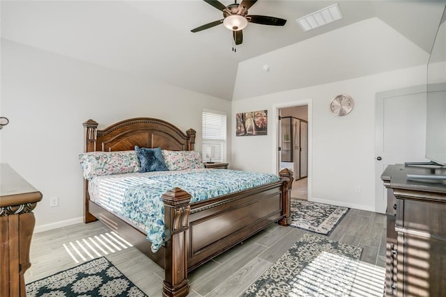 18445 Austin Pl, Edmond, OK 73012 - bedroom featuring wood finished floors, vaulted ceiling, and ceiling fan