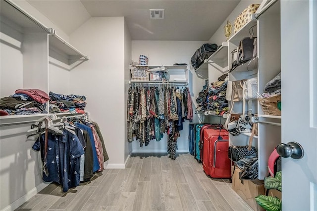 18445 Austin Pl, Edmond, OK 73012 - spacious closet featuring wood finished floors
