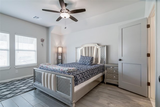 18445 Austin Pl, Edmond, OK 73012 - bedroom with light wood-style flooring and a ceiling fan