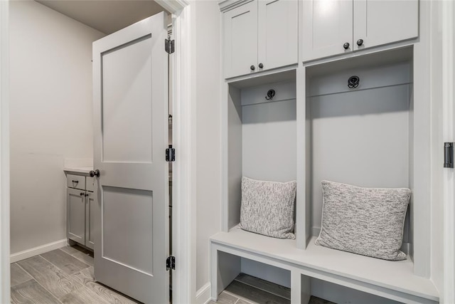 18445 Austin Pl, Edmond, OK 73012 - mudroom featuring light wood-style floors and baseboards