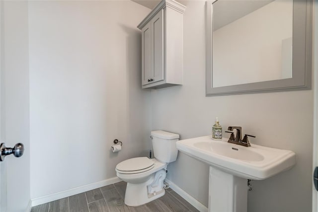 18445 Austin Pl, Edmond, OK 73012 - half bathroom featuring toilet and wood tiled floors