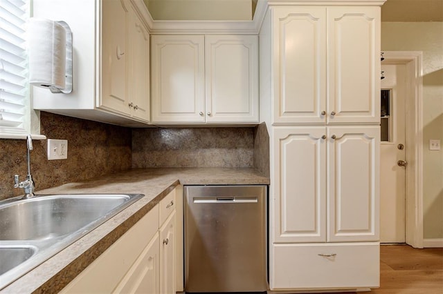 3725 N Grant Ave, Bethany, OK 73008 - kitchen featuring stainless steel dishwasher, light wood-type flooring, decorative backsplash, and white cabinetry
