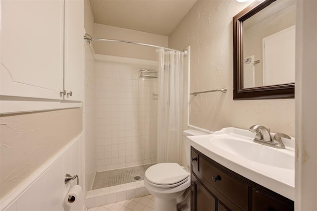 3725 N Grant Ave, Bethany, OK 73008 - bathroom with vanity, a stall shower, a textured ceiling, a textured wall, and tile patterned floors