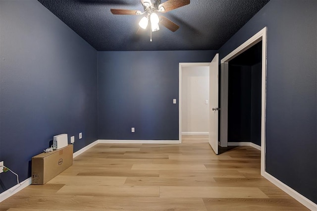 3725 N Grant Ave, Bethany, OK 73008 - unfurnished room featuring ceiling fan, wood finished floors, and a textured ceiling
