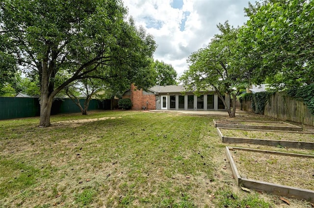 3725 N Grant Ave, Bethany, OK 73008 - fenced backyard with a garden and a sunroom