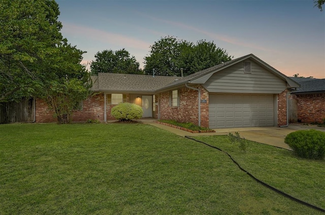 3725 N Grant Ave, Bethany, OK 73008 - ranch-style home featuring an attached garage, concrete driveway, a lawn, and brick siding