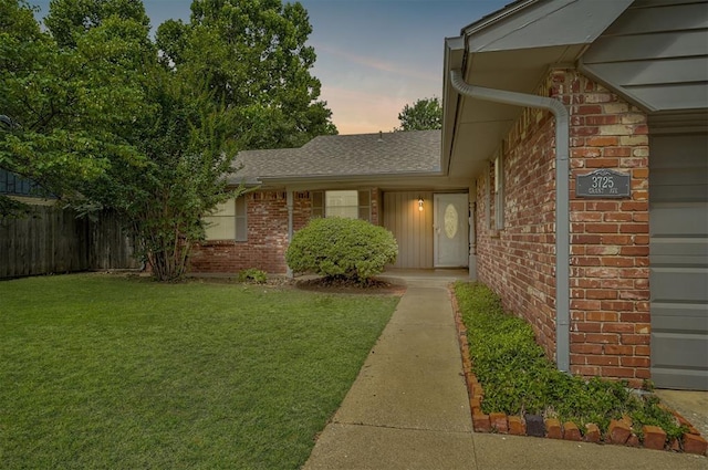 3725 N Grant Ave, Bethany, OK 73008 - property entrance with brick siding, a garage, and roof with shingles