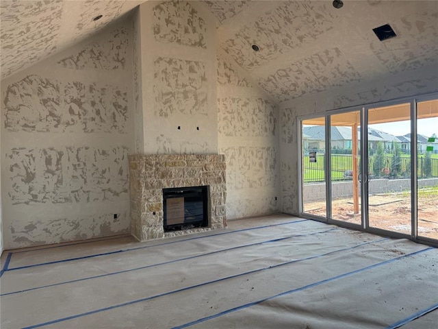 5901 Calcutta Ln, Edmond, OK 73025 - unfurnished living room with lofted ceiling and a stone fireplace
