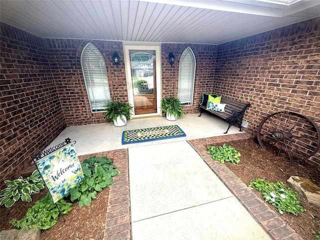 2608 SW 93rd, Oklahoma City, OK 73159 - doorway to property featuring brick siding