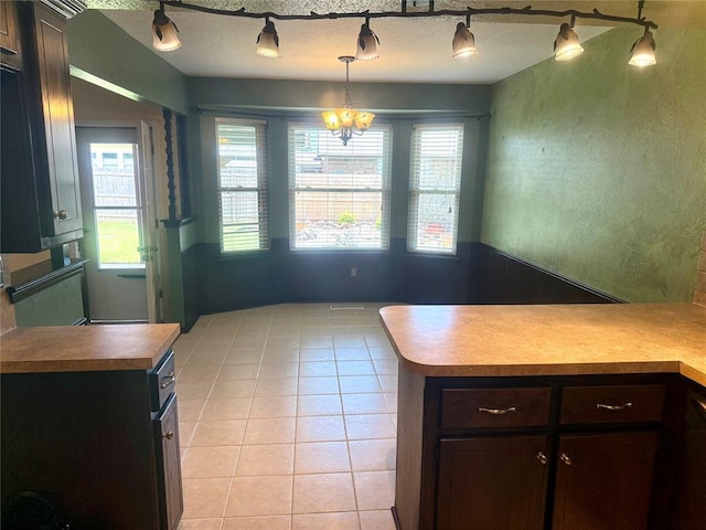 2608 SW 93rd, Oklahoma City, OK 73159 - dining room with light tile patterned floors, healthy amount of natural light, and a chandelier
