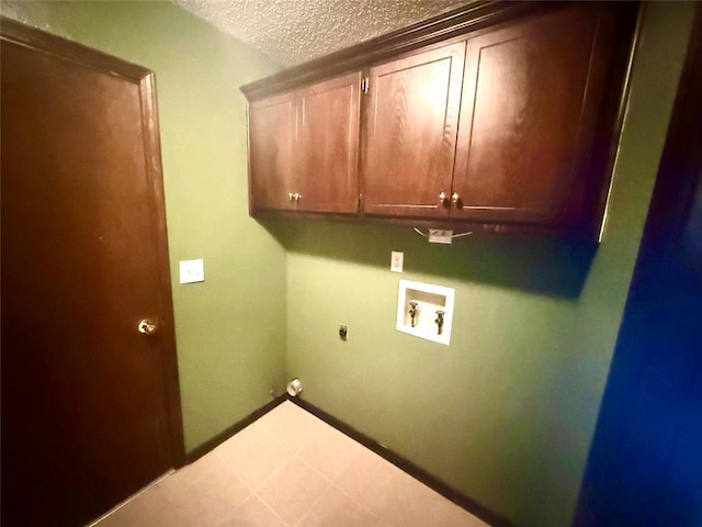 2608 SW 93rd, Oklahoma City, OK 73159 - laundry area with cabinet space, hookup for a washing machine, hookup for an electric dryer, and a textured ceiling