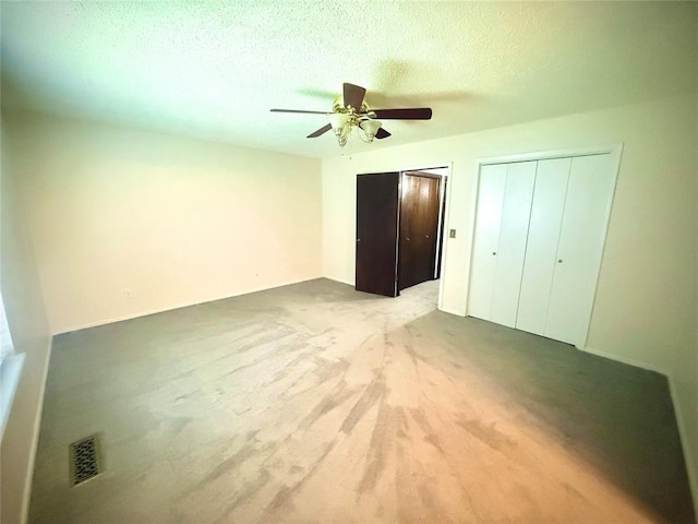 2608 SW 93rd, Oklahoma City, OK 73159 - unfurnished bedroom featuring a textured ceiling, carpet floors, and ceiling fan