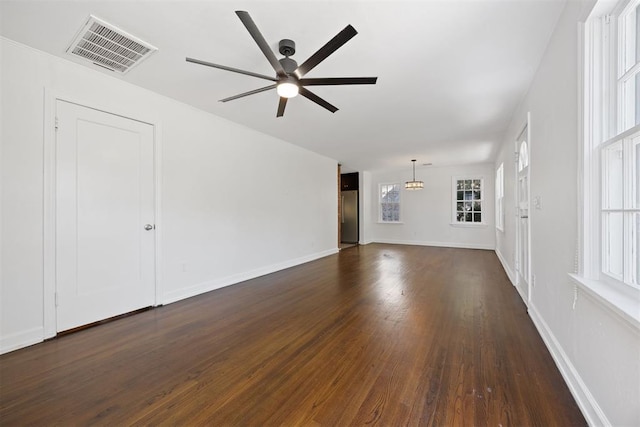 536 NW 48th St, Oklahoma City, OK 73118 - unfurnished living room with a ceiling fan and dark wood-type flooring