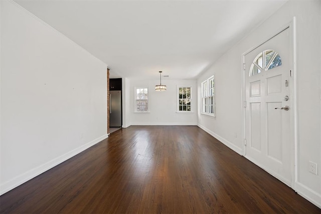 536 NW 48th St, Oklahoma City, OK 73118 - foyer entrance featuring dark wood-type flooring and a chandelier