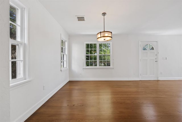 536 NW 48th St, Oklahoma City, OK 73118 - spare room featuring wood finished floors and baseboards