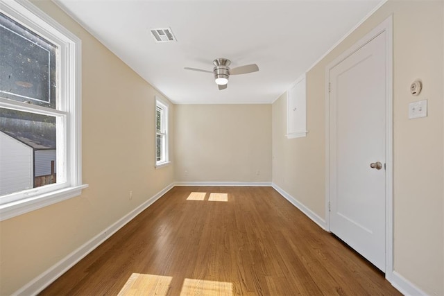 536 NW 48th St, Oklahoma City, OK 73118 - empty room with wood finished floors and a ceiling fan