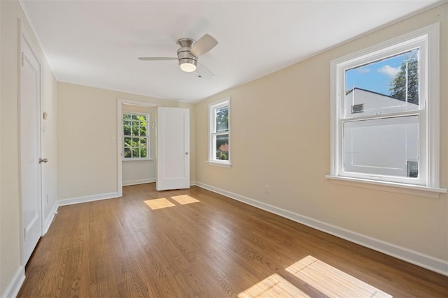 536 NW 48th St, Oklahoma City, OK 73118 - unfurnished bedroom with wood finished floors and ceiling fan