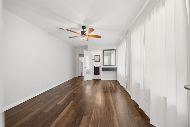 536 NW 48th St, Oklahoma City, OK 73118 - unfurnished living room featuring a ceiling fan and dark wood finished floors