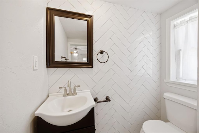 536 NW 48th St, Oklahoma City, OK 73118 - half bathroom featuring vanity and tile walls