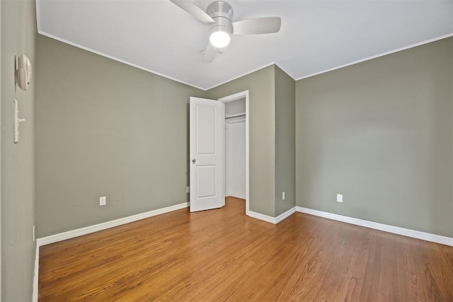 536 NW 48th St, Oklahoma City, OK 73118 - unfurnished bedroom featuring ornamental molding, wood finished floors, ceiling fan, and a closet
