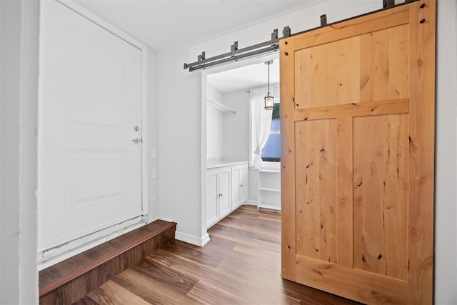 536 NW 48th St, Oklahoma City, OK 73118 - mudroom featuring a barn door and wood finished floors