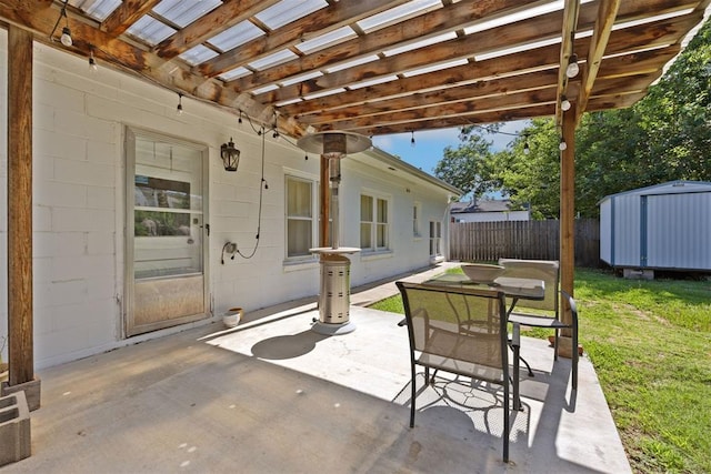 536 NW 48th St, Oklahoma City, OK 73118 - view of patio / terrace with a storage shed and a pergola