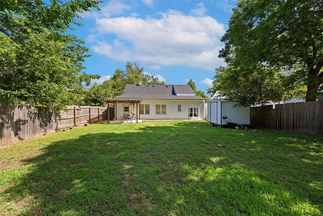 536 NW 48th St, Oklahoma City, OK 73118 - back of property featuring a storage shed, a fenced backyard, and a patio
