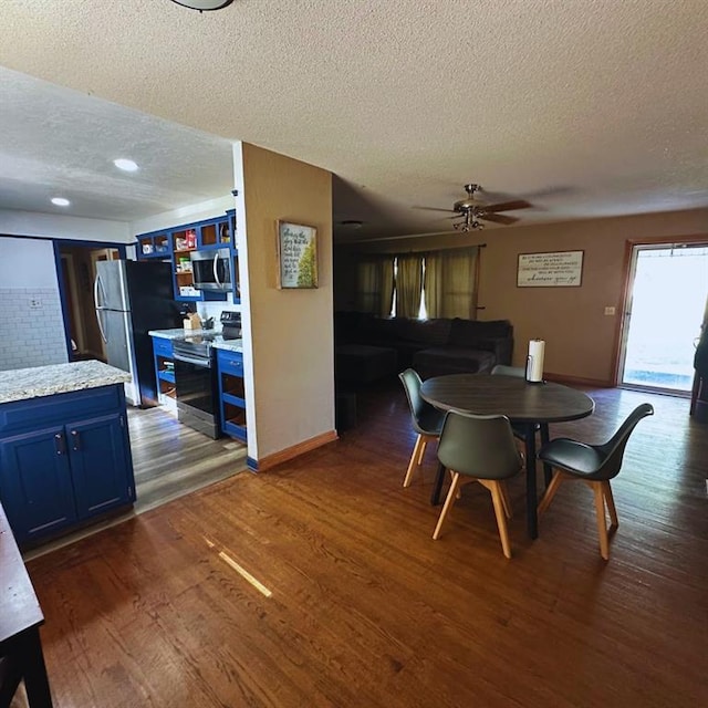 701 S 18th St, Clinton, OK 73601 - dining area with a textured ceiling, dark wood-style flooring, a ceiling fan, and recessed lighting