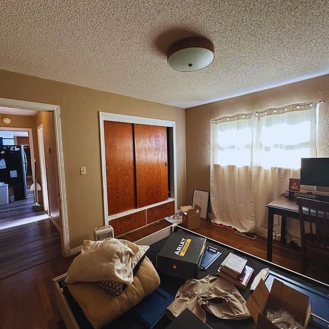 701 S 18th St, Clinton, OK 73601 - living area with a textured ceiling and wood finished floors