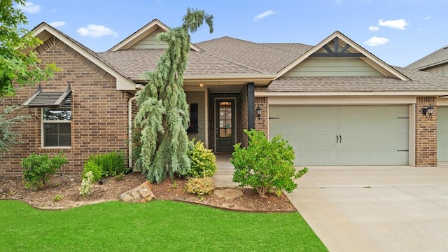3021 NW 179th Ct, Edmond, OK 73012 - view of front of home with brick siding, a garage, a shingled roof, driveway, and a front lawn