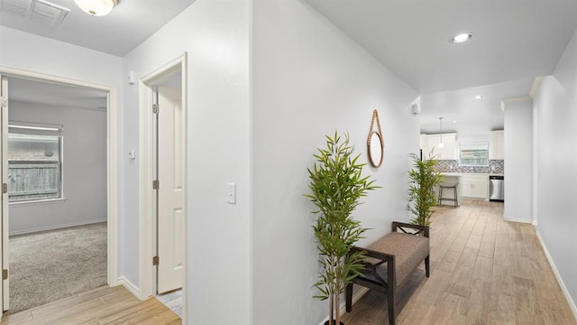 3021 NW 179th Ct, Edmond, OK 73012 - hall featuring light wood-style flooring and baseboards