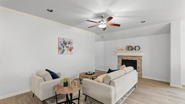 3021 NW 179th Ct, Edmond, OK 73012 - living room with ceiling fan, light wood-style flooring, a fireplace, and ornamental molding