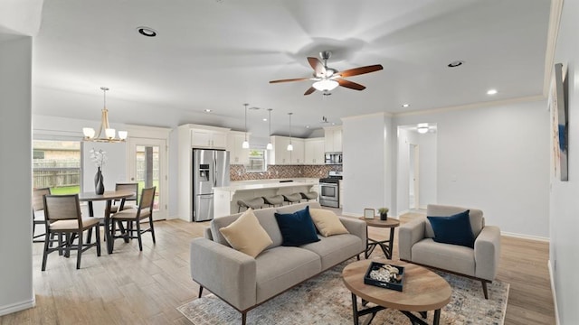 3021 NW 179th Ct, Edmond, OK 73012 - living area with a chandelier, ceiling fan, light wood-type flooring, and recessed lighting