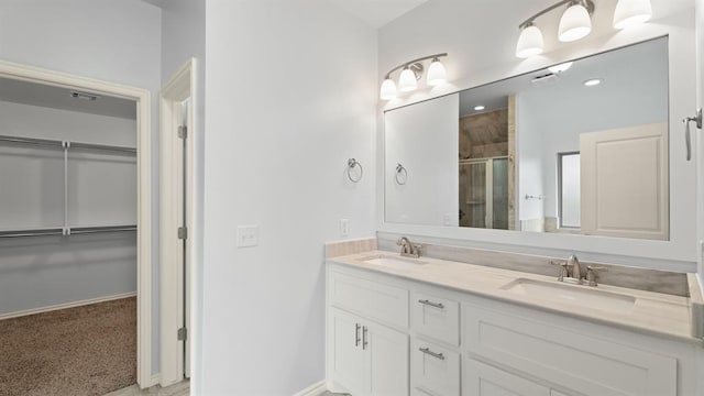 3021 NW 179th Ct, Edmond, OK 73012 - full bath featuring a stall shower, double vanity, and a spacious closet