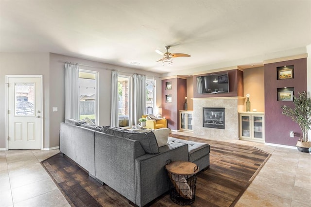 17425 White Hawk Dr, Edmond, OK 73012 - tiled living room featuring a ceiling fan and a tile fireplace