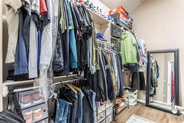 17425 White Hawk Dr, Edmond, OK 73012 - spacious closet with wood finished floors
