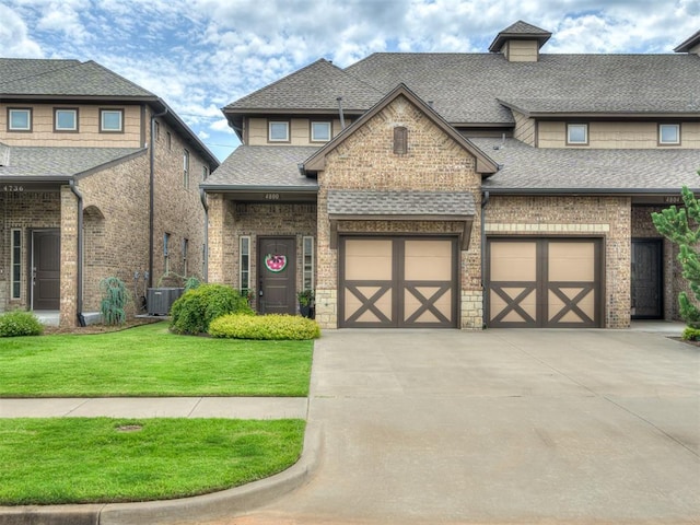 4800 Stelens Ct, Norman, OK 73071 - view of front of property with roof with shingles, concrete driveway, and a front yard