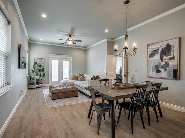 4800 Stelens Ct, Norman, OK 73071 - dining space with light wood-style floors, recessed lighting, ceiling fan, crown molding, and a chandelier